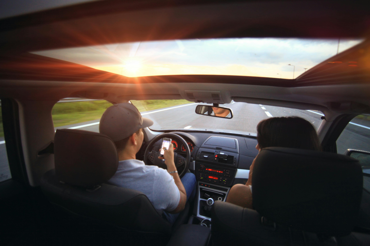 Driver managing distractions and weather-related risks